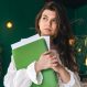 beautiful-business-woman-with-folder-papers-green-interior_169016-23256