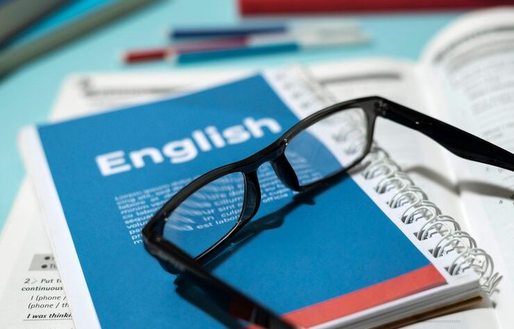 english-book-with-glasses-table_23-2149429624