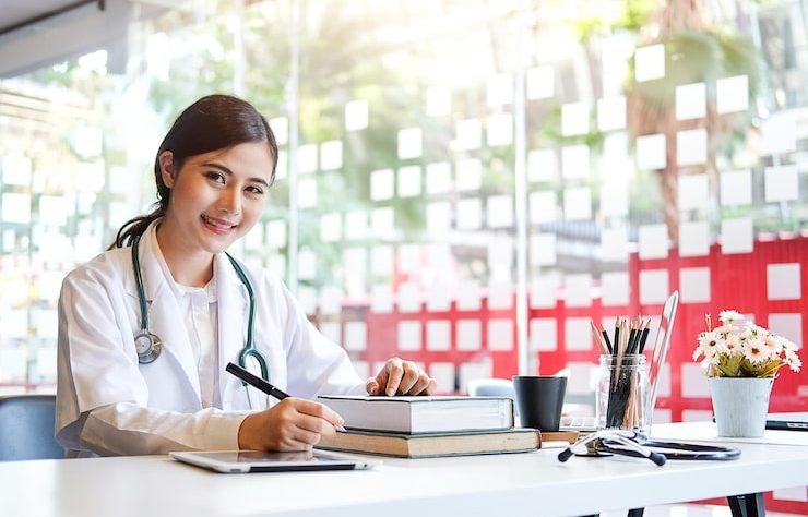 portrait-female-doctor-sitting-desk-hospital_1048944-23120073
